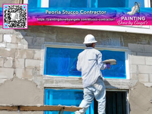 A professional painter in white overalls applying blue paint to the exterior wall of a building with a brush, advertising for a stucco repair contractor service.