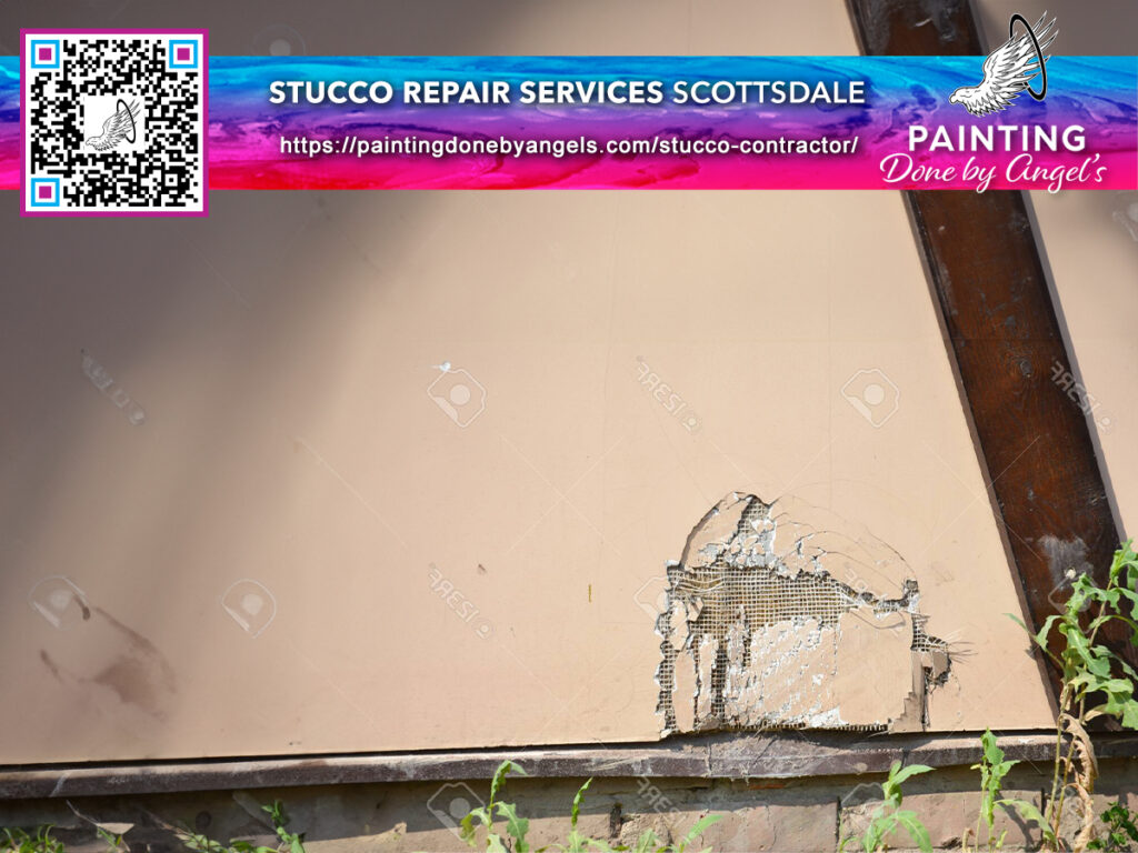 A damaged stucco wall with visible cracking and peeling, in need of repair services, now also featuring an advertisement for a painting company specializing in interior painting in Scottsdale.