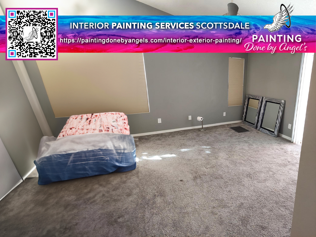 A freshly painted residential room featuring a two-tone color scheme with an empty space indicating ongoing interior work, promotional material for painting services, and drywall repair.