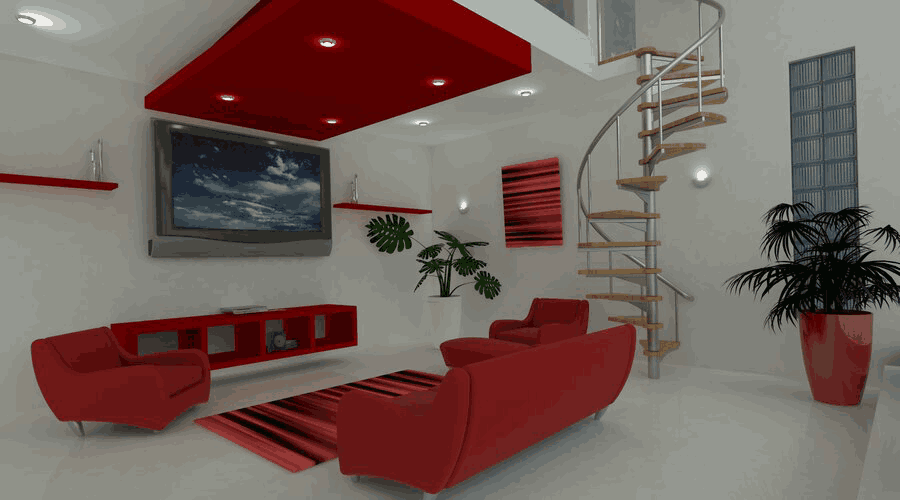 A modern living room with white walls featuring a striking red and white color scheme, with a plush red sofa set, red wall shelves, and a spiral staircase leading to an upper level. A large framed