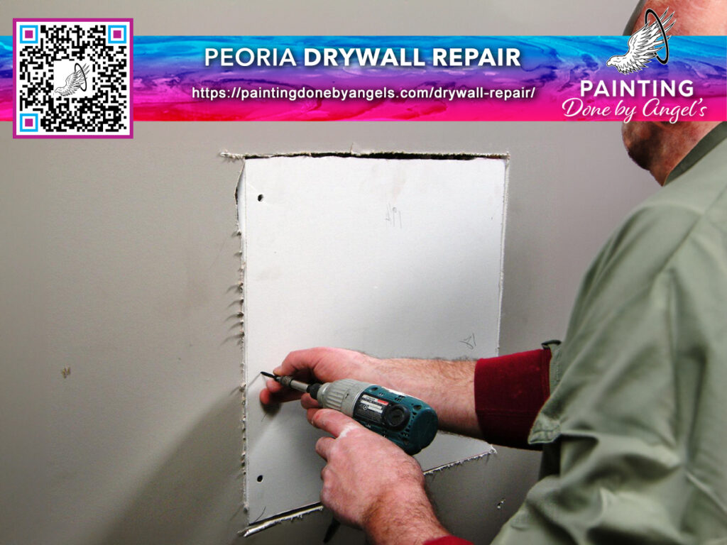 A professional worker meticulously repairing drywall damage with a power tool, adhering to strict safety protocols, advertising Peoria AZ drywall repair services by painting done by angels.